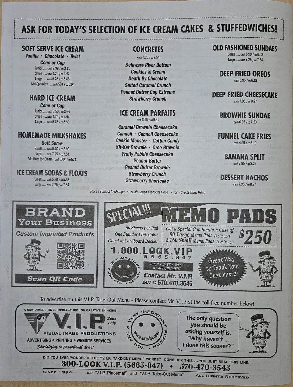 Salads and quesadillas listed on a simple menu.