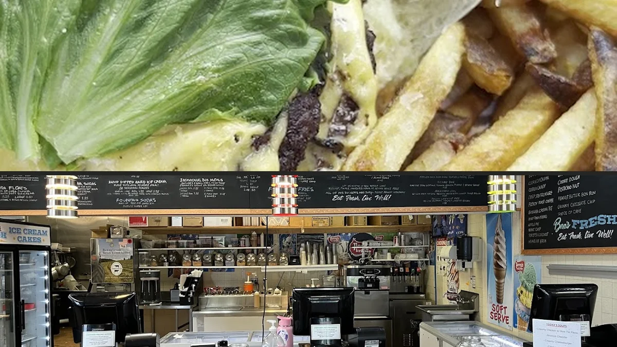 Fresh burgers and fries on a casual restaurant table.